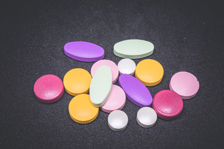 Colorful Medicine, Pharmacy. Tablets on the black background.の写真素材