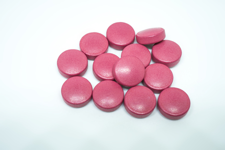 Red Medicine, Pharmacy. Tablets on the white background.の写真素材