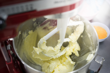 There are mix butter and eggs to prepare to make bread and cookies.の写真素材