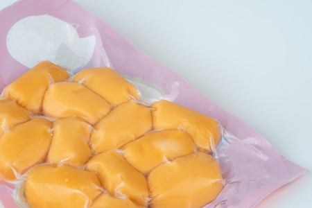 Sausages in plastic pack in white background.の写真素材