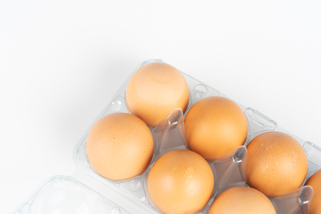 the pack of eggs in plastic packaging with white background.の写真素材