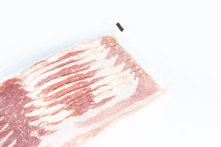 Bacons in plastic pack in white background.の写真素材
