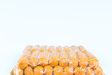 Sausages in plastic pack in white background.の写真素材