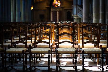 Chairs or benches in the church expresses loneliness and anticipation.の写真素材