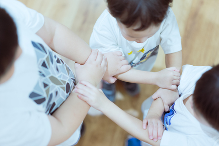 The hand coordination of childrens to show their unity and spirit.の写真素材