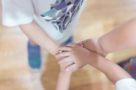 The hand coordination of childrens to show their unity and spirit.の写真素材