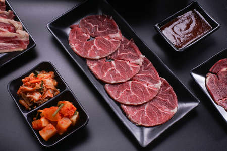 Shabu Shabu or Sukiyaki, a popular dish of pork, beef, shrimp, squid, seafood and fresh vegetables. Placed on a table with a boiling pot boiling in a Japanese restaurant.の写真素材