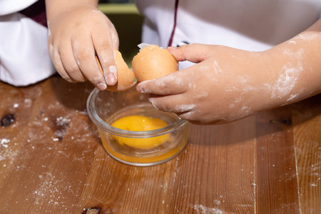 A boy is make bun for pizza. Little chef is making pizza.