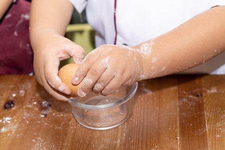 A boy is make bun for pizza. Little chef is making pizza.