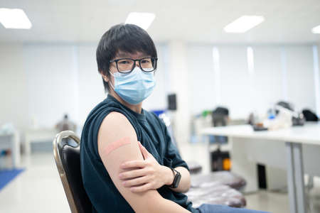A man received vaccines to prevent covid-19.の写真素材