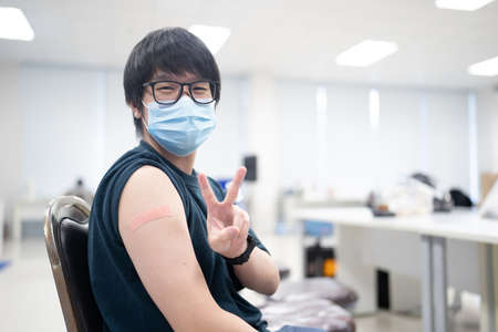 A happy man received vaccines to prevent covid-19.の写真素材