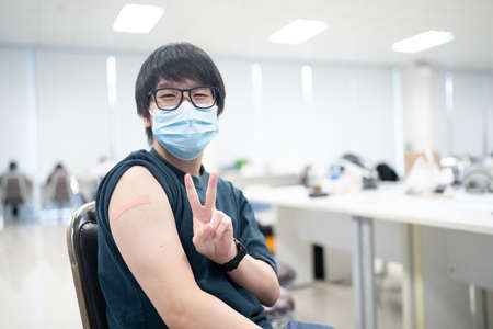 A happy man received vaccines to prevent covid-19.の写真素材
