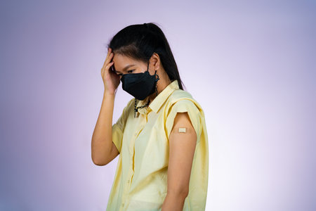 A working woman headache because vaccine side effect.の写真素材