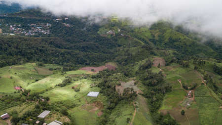 In the fog and clouds, a panoramic view of the Thai mountains.の写真素材
