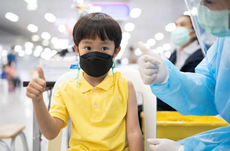 A boy gets get vaccinated against COVID-19.の写真素材
