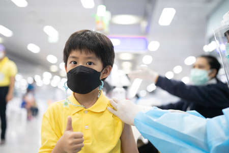 Bangkok, Thailand - March 9, 2022 Children are taking steps to get vaccinated against COVID-19 at Bang Sue Railway Stationの写真素材