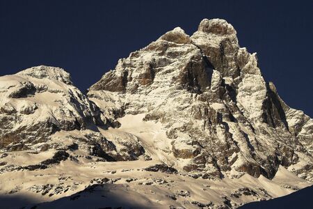 Mountain covered in snow, winter scene in the Italian Alpsの写真素材