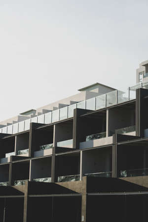 Newly built condominiums. Stylish exterior apartment photographed in a minimalist style.の写真素材