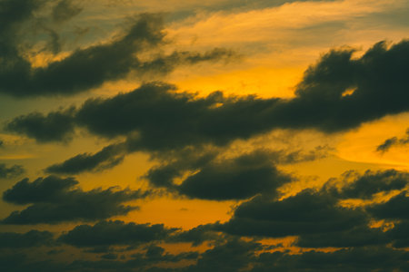 The sky during the sunset is beautiful, exotic with yellow and orange blends together at Phayun Beach, Ban Chang, Rayong.の写真素材