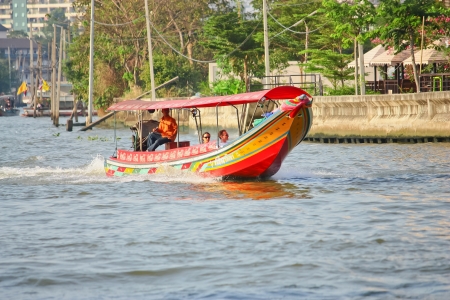 BANGKOK, THAILAND, JAN. 3: Long- tail boat with tourists exploring Bangkok Noi canal,Cho Praya River in  Bangkok on JAN 3, 2010.のeditorial素材