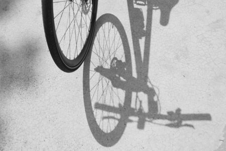 Bicycle wheel and shadow on blackgroundの写真素材