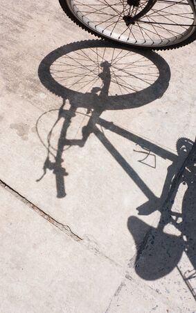 Bicycle wheel and shadow on blackgroundの写真素材