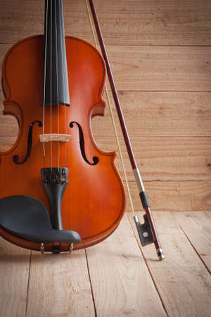 Violin and fiddle on wood backgroundの写真素材