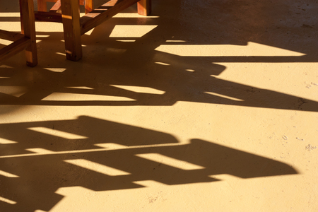 Shadow of chairs and tables on floorの写真素材