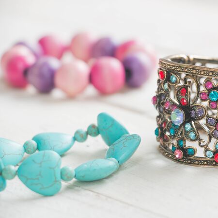 Bracelet on white wood background
