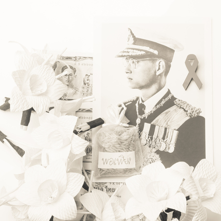 BANGKOK,THAILAND-MAY 21,2017-Picture and flowers to commemorate His Majesty King Bhumibol Adulyadej,King of Thailand who died on October 13,2016のeditorial素材