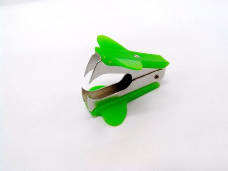 Staple remover on a white .