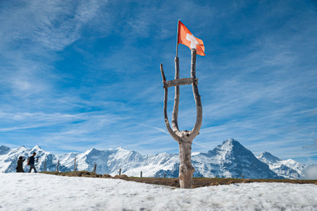 Swiss flag on a stump in front of the Matterhorn, Zermatt, Switzerlandの写真素材