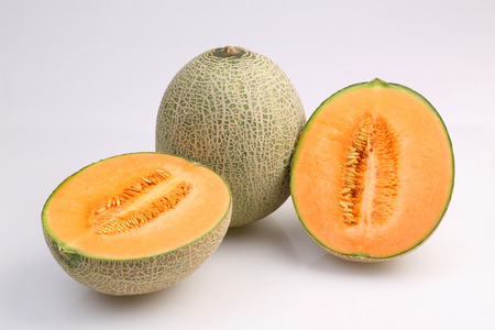 Organic Cantaloupe melon fruit isolated on white background.の写真素材