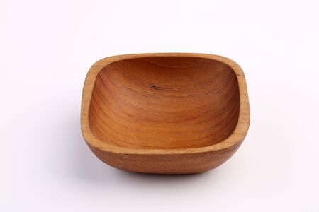 Wooden bowl made by Teak isolated on white backgroundの写真素材