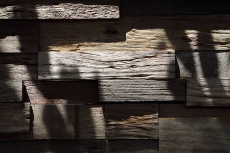 Old grunge wooden with shadow on wall- background texture.の写真素材