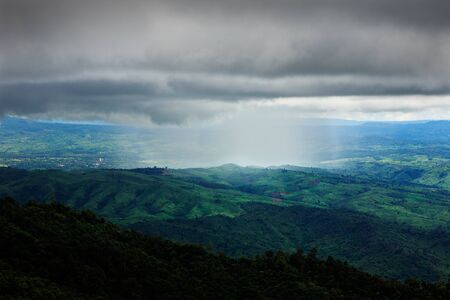 Amazing nimbus with rain over rainforest mountain, Chiang Mai, Thailand.