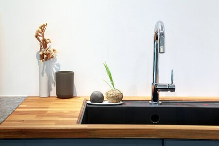 Modern sink with decoration in kitchen room.