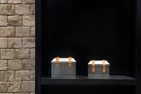 Showcase of home decor metal box on Shelves in modern living room.の写真素材