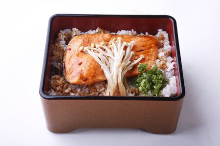 Grilled salmon teriyaki with japanese rice in box isolated on white.の写真素材
