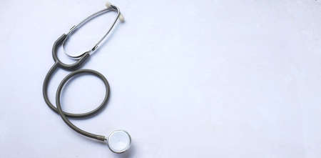 top view and flat lay stethoscope isolate on a white Doctor's desk background.
concept Health care and 
Treating the sickの写真素材