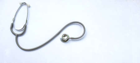copy space and flat lay stethoscope isolate on a white Doctor's desk background.
concept Health care...