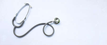 top view and flat lay stethoscope isolate on a white Doctor's desk background.
concept Health care and 
Treating the sickの写真素材