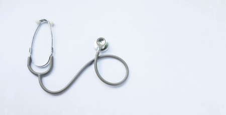 top view and flat lay stethoscope isolate on a white Doctor's desk background.
concept Health care and 
Treating the sickの写真素材