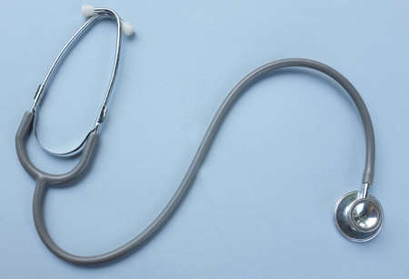 flat lay and top view stethoscope isolate on a gray Doctor's desk background.
concept Health care and 
Treating the sickの写真素材