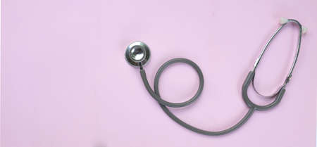 top view and flat lay stethoscope isolate on a pink pastel Doctor's desk background.
concept Health...