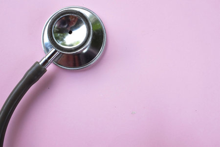 copy space  stethoscope isolate on a pink pastel Doctor's desk background.
concept Health care and 
Treating the sickの写真素材