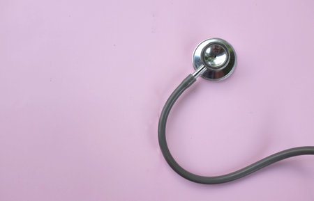 top view and flat lay stethoscope isolate on a pink pastel Doctor's desk background.
concept Health care and 
Treating the sickの写真素材
