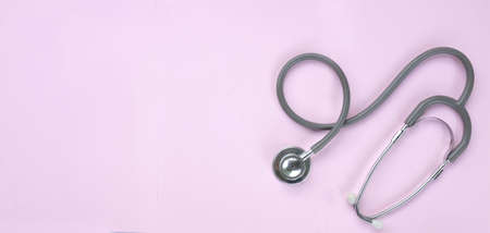 copy space  stethoscope isolate on a pink pastel Doctor's desk background.
concept Health care and 
Treating the sickの写真素材