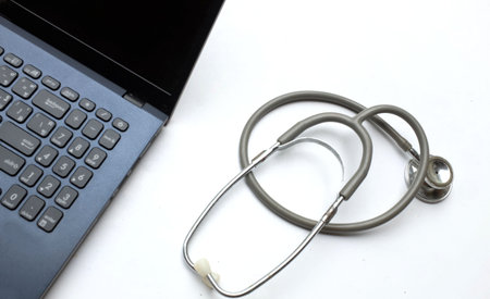 Stethoscope and laptop on white background. Medical equipment concept.