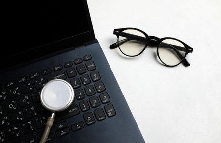Medical stethoscope and laptop computer ,
glasses on
On the doctor's desk. Online medical, e-health...